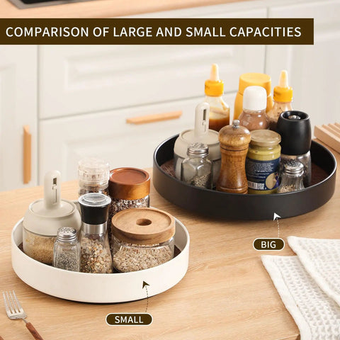 Comparison of large black and small white rotating Lazy Susans with condiments in a kitchen setting.
