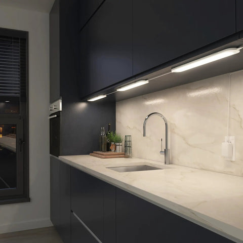 Under cabinet kitchen counter with RGB under cabinet lighting kit with motion sensor, 3 ultra thin panels, plug in lights in use.