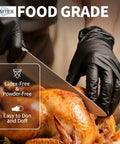 Person using Heavy Duty 3.5 Mil Nitrile Disposable Gloves In Bold Black to slice a roasted chicken, highlighting food safety.