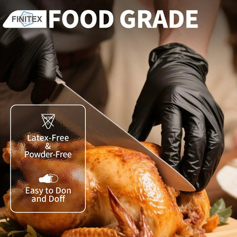 Person using Heavy Duty 3.5 Mil Nitrile Disposable Gloves In Bold Black to slice a roasted chicken, highlighting food safety.