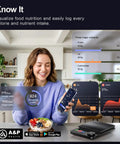 Woman using Smart Food Kitchen Scale With Nutritional Calculator And Timer, smartphone showing nutrients data, in kitchen.