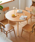 Modern dining room with round table and wooden chairs, emphasizing 24 Inch Solid European Beech Wood Table Legs Set Of 4 For Desks And Coffee Tables With Angled Mounting Plates Mid Century Modern Style Built Tough Heavy Duty 500lb Capacity Easy Install.