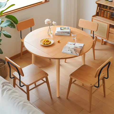 Modern dining room with round table and wooden chairs, emphasizing 24 Inch Solid European Beech Wood Table Legs Set Of 4 For Desks And Coffee Tables With Angled Mounting Plates Mid Century Modern Style Built Tough Heavy Duty 500lb Capacity Easy Install.