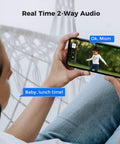 Person using 4K PoE PTZ Security Camera System With Auto Human Tracking on phone displaying real-time outdoor video and 2-way audio.