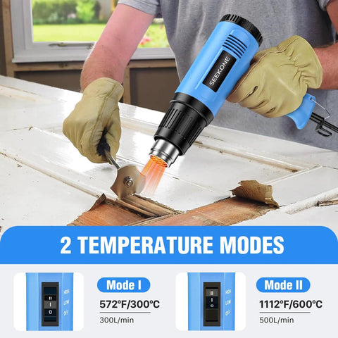 Person using 1800W Heat Gun Kit With Dual Temp 572F And 1112F, Heavy Duty Hot Air Tool For Stripping Paint on wood surface