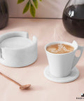 Set Of Six Round Marble Coasters With Secure Holder White Polished Stone For Kitchen Countertops Modern Minimalist Design coffee cup on marble coaster