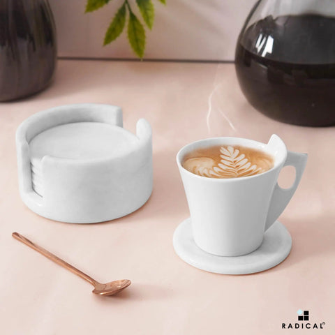 Set Of Six Round Marble Coasters With Secure Holder White Polished Stone For Kitchen Countertops Modern Minimalist Design coffee cup on marble coaster
