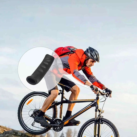 Cyclist on mountain bike with Three Pairs Black Bicycle Brake Lever Grips With Anti Slip Silicone Texture for diverse conditions.