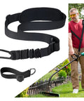 Heavy Duty Trimmer Strap Harness For Weed Eater With Upgraded Elastic Part And Metal Clasp All Day Comfort Shoulder Pad Compatible With EGO And Greenworks String Trimmers Leaf Blowers And Shrub Trimmers shown installed on a person trimming lawn.
