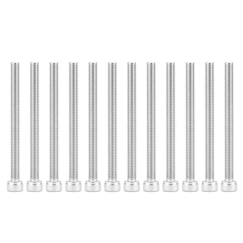Close-up of long metal screws lined up on a white background.