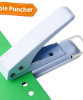 Heavy Duty 1/4 Inch Single Hole Paper Punch For Crafts and Office Use, all-metal punch tool on green paper