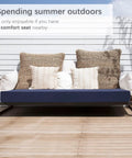 Outdoor Bench Cushion 42 By 18 Inch Waterproof Patio Cushion With Handle And Ties on a wooden bench with pillows