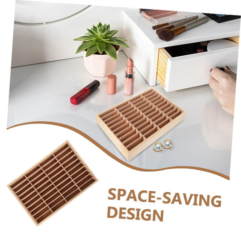 Totally Game Changing Wood Jewelry Tray With Plush Suede Grid Organization Board featuring 40 dedicated spaces on a vanity.