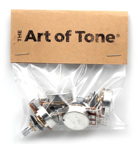 Four Bourns 500K short split-shaft audio-taper potentiometers; metal bodies in plastic bag with The Art of Tone card