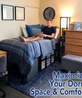 Game Changing College Dorm Bed Expansion Kit To Convert Twin Xl To 48 Inch Wide Mattress Base Featuring Heavy Duty Wooden Bunkie Board And Quick Setup Straps on a dorm bed with a student using a laptop.