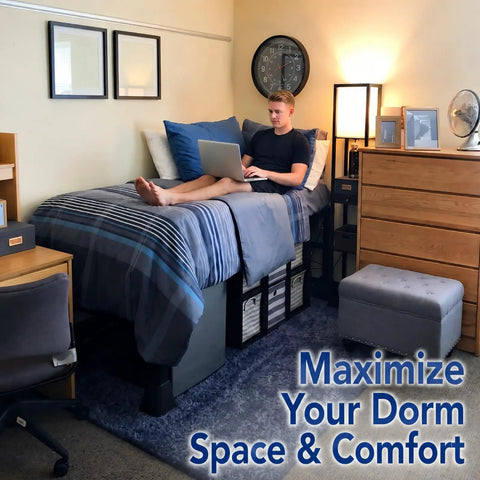 Game Changing College Dorm Bed Expansion Kit To Convert Twin Xl To 48 Inch Wide Mattress Base Featuring Heavy Duty Wooden Bunkie Board And Quick Setup Straps on a dorm bed with a student using a laptop.