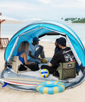 Group relaxing in Pop Up Beach Tent For 2 To 4 People Large Sun Shade Shelter With Instant Setup No Poles Or Tools on beach