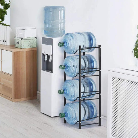 Heavy Duty 4 Tier Water Jug Rack for 5 Gallon Jugs Detachable Black Metal Bottle Holder next to a water dispenser in office