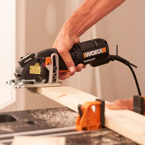 Compact Palm Saw With 3 Amp Motor And 3 3/8 Inch Blade For Clean Cuts Through Wood Aluminum Siding And Tile Ergonomic Thumb Grip Lightweight Rotary Trimmer handles a wood plank.