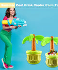 Three Pack 27 Inch Inflatable Palm Tree Coolers Giant Blow Up Drink Holders for pool party and beach decor with woman holding a toy gun.