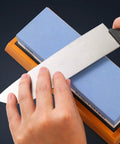 Hand using Premium Knife Sharpening Stone Whetstone 1000 6000 Grit With Non Slip Base Angle Guide and Wet Stone Sharpening Kit