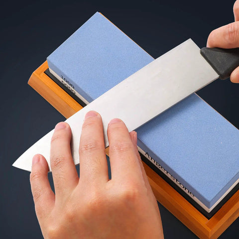 Hand using Premium Knife Sharpening Stone Whetstone 1000 6000 Grit With Non Slip Base Angle Guide and Wet Stone Sharpening Kit