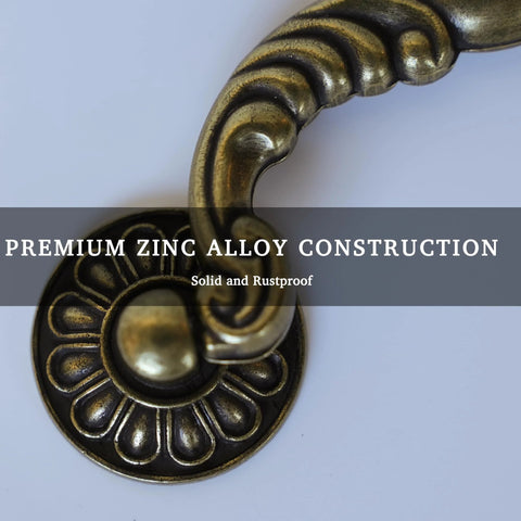Close-up of Six Pack Vintage Drop Bail Cabinet Handles In Antique Brass Finish, featuring premium zinc alloy construction.