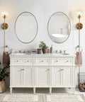Bathroom with Slick Modern Long Globe Plug In Wall Sconce Lights Set Of 2 With Clear Glass Globes Brass Gold Finish beside mirrors.