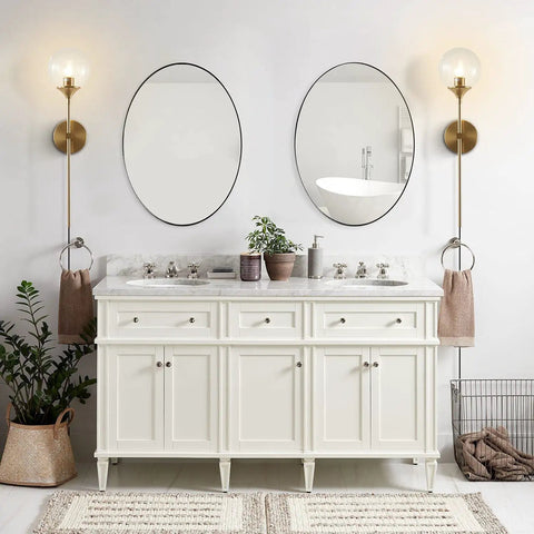 Bathroom with Slick Modern Long Globe Plug In Wall Sconce Lights Set Of 2 With Clear Glass Globes Brass Gold Finish beside mirrors.