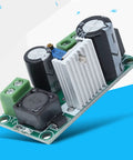 No Fuss Adjustable Dc Dc Power Supply Module Featuring Wide 5V To 48V Input Range and smooth output, showcased with a heat sink.