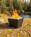Portable 35 Inch Smokeless Fire Pit For Outdoors With Carry Handle Stainless Steel Pellet Fire Pit For Outside Wood Burning Ideal For Backyard Patio Hangouts Bonfires Low Smoke Design With Enhanced Airflow For Up To 6 People Black next to wood pile in autumn forest.