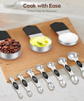 Magnetic Measuring Cups And Spoons Set With 304 Stainless Steel Dual Sided Design 15 Piece Kit Includes Leveler displayed on board.