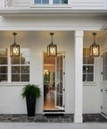 Straight Up Heavy Duty Outdoor Pendant Light With Automatic Dusk To Dawn Sensor 18.5 Inch porch chandelier illuminating entryway.