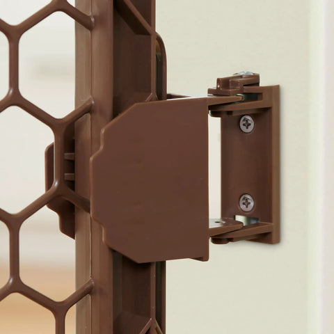 Close-up of latch mechanism of Super Wide 192 Inch Baby Gate And Play Yard System, brown hardware-mounted connector.