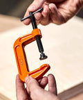 2-1/2 Inch C Clamp Heavy Duty For Woodworking And DIY Projects, 600 Pound Load Capacity, 2 Inch Opening, orange clamp in hand