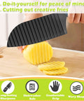 Front view of JAYVAR crinkle cutter wavy veggie slicer with black blade, slicing a potato on a wooden board.