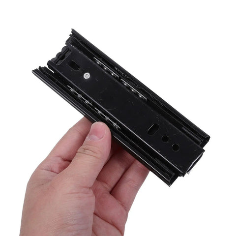Close-up of black Full Extension Drawer Slides 5 Inch Pack Of 4 Quiet Side Mount Cabinet Rails Made From Cold Rolled Steel in hand.