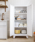 Huge 61 Inch Farmhouse Pantry Cabinet With Two Barn Doors, White Finish, showing interior shelves and organized kitchen items.