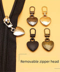 Multicolor Heart Shaped Zipper Pull Replacement Kit For Backpacks Coats Jackets Pants And Luggage 5Pcs Metal Zipper Fixer Repair Set With Durable Pulls And Sewing Notions For Easy Quick Fixes On The Go shown with four metal heart-shaped pulls and a zipper.