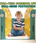 Child sitting in a green and yellow extra-wide corridor of 8 In 1 Toddler Climber And Slide Playset With Basketball Hoop For Indoor And Outdoor Fun Compact All In One Playground Center To Boost Kids Motor Skills And Confidence
