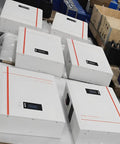No Fuss Plug And Go 10Kwh Lifepo4 Solar Battery Smart Touch Display 51.2V 200Ah wall mounted units in a warehouse setting.