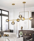 Modern Gold Pendant Lighting With Smoke Gray Glass Globes Adjustable 6-Light Hanging Ceiling Fixture For Living Room Dining Room Kitchen And Bedroom With A Soft Glow For A Cozy Vibe.