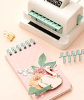 Mini Cinch Binding Tool For DIY Books And Notebooks With Wire Or Spiral Coils Pro Grade Mini Binding Machine shown with notebook