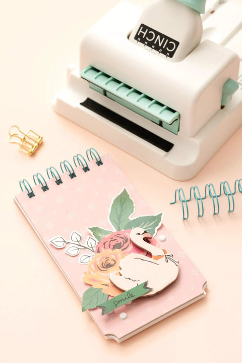 Mini Cinch Binding Tool For DIY Books And Notebooks With Wire Or Spiral Coils Pro Grade Mini Binding Machine shown with notebook