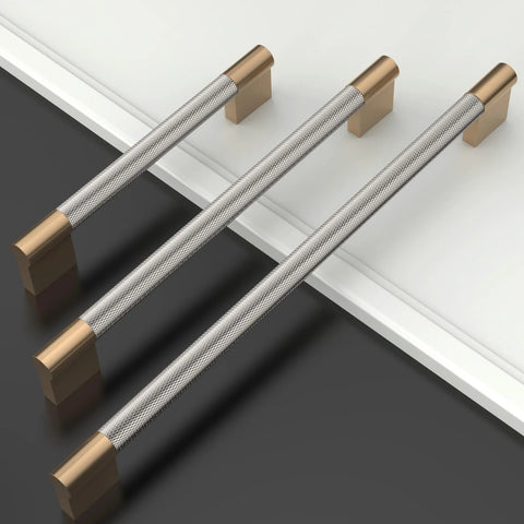 Three 10 Pack Five Inch Knurled Cabinet Pulls In Brushed Satin Nickel And Champagne Bronze for kitchen cabinets displayed on a surface