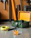 Badass Multi User Insulated Nylon Lockout Hasp With Four Reinforced Holes For Safety Tagout Protocols Built Tough For Industrial Valve Operations And Electrical Panel Maintenance Grind, displayed with a green toolbox and safety rope.