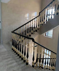Hella Tough Aluminum Stair Balusters With Flexible Zero To Two Seventy Degree Pivot Bracket For Bulletproof Pet And Kid Safety Fencing Plus Super Simple Floor Mount Install For Indoor Steps And Lofts, featuring elegant black and gold spindles on staircase.