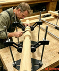 Heavy Duty Adjustable Pipe Rolling Rig With Rock Solid V Frame Base For Smooth Spinning During Cutting Engraving Polishing And Garage Builds Plus No Sweat Height Tweaks And Snug Lock Clamps For Serious Fab Bench Performance, shown in use with wooden pipe.