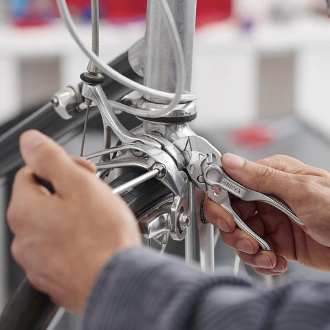 Person using Pliers Wrench XS 4 Inch One Hand Quick Adjust Pliers for Gripping Holding Pressing and Bending Up To Three Quarter Inch.