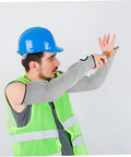 Man wearing Heavy Duty Cut Resistant Arm Sleeves With Thumb Hole Built Tough As Nails For Welding And Gardening, using scissors.